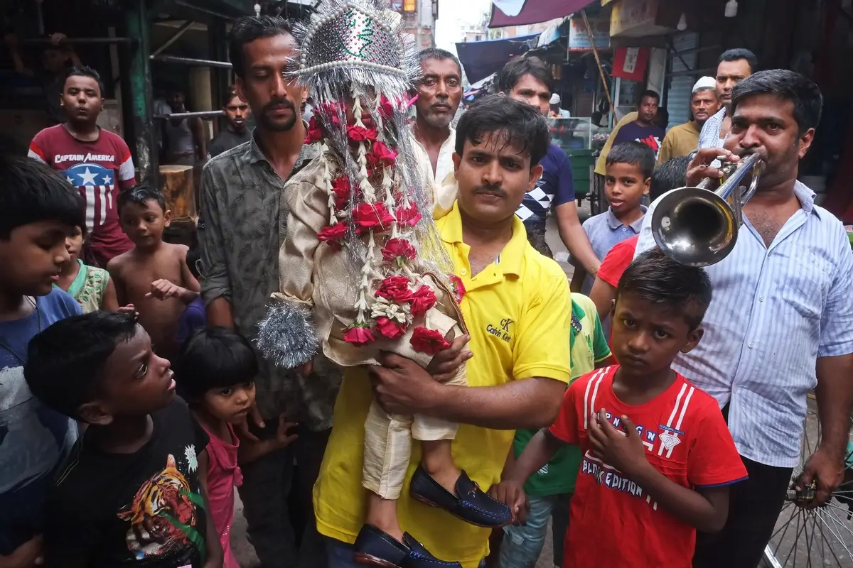 Circumcision of kid ,dressed as new grooms, its a tradition of camp<p>© MD Saiful Amin</p>